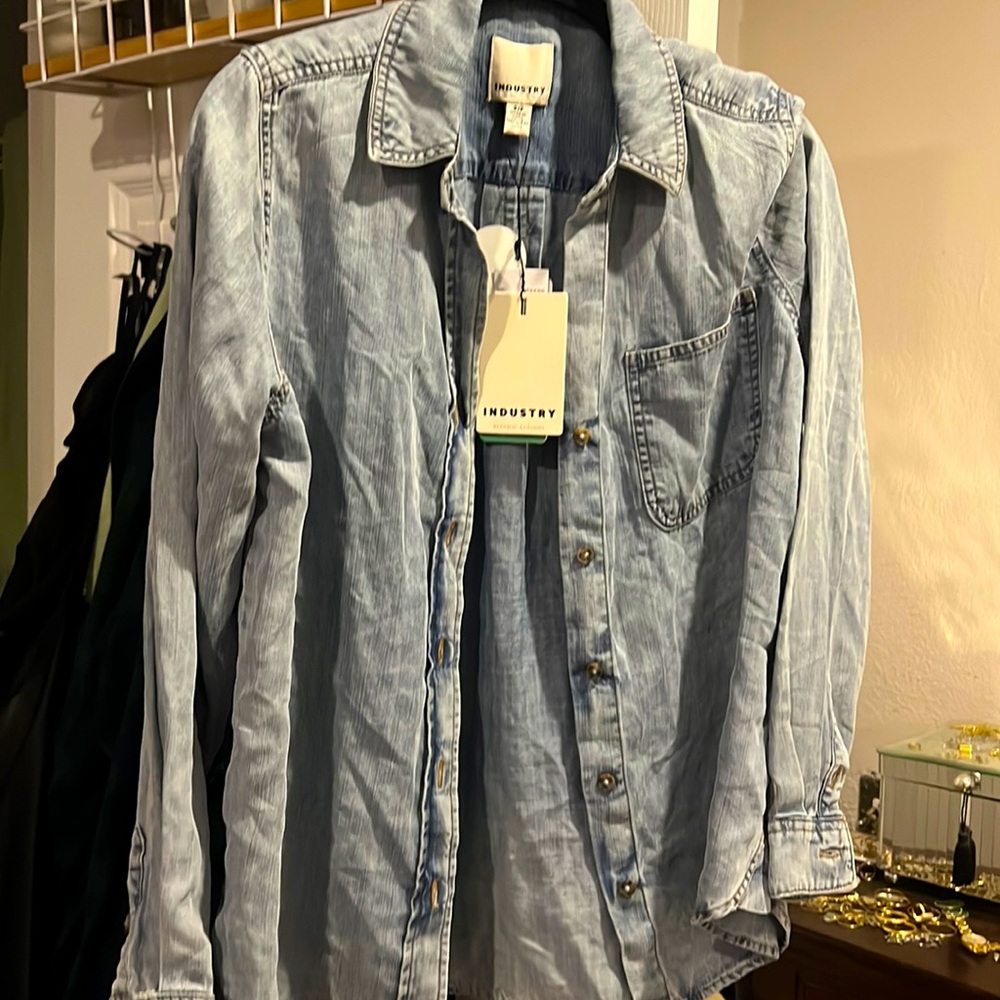 Women’s denim button up shirt.